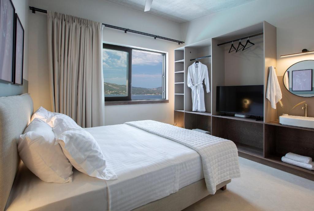 Bedroom with sea-view window, open wardrobe and vanity area