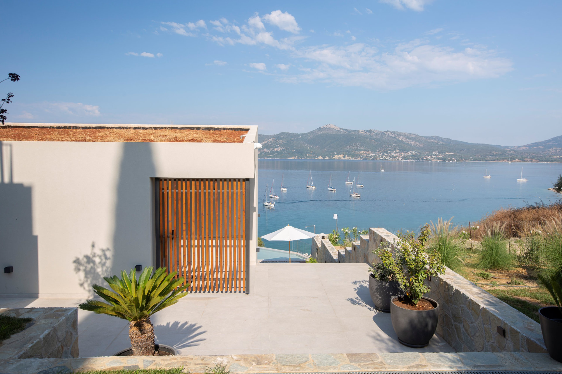 Villa terrace with sea view over Paleros bay and moored sailing boats