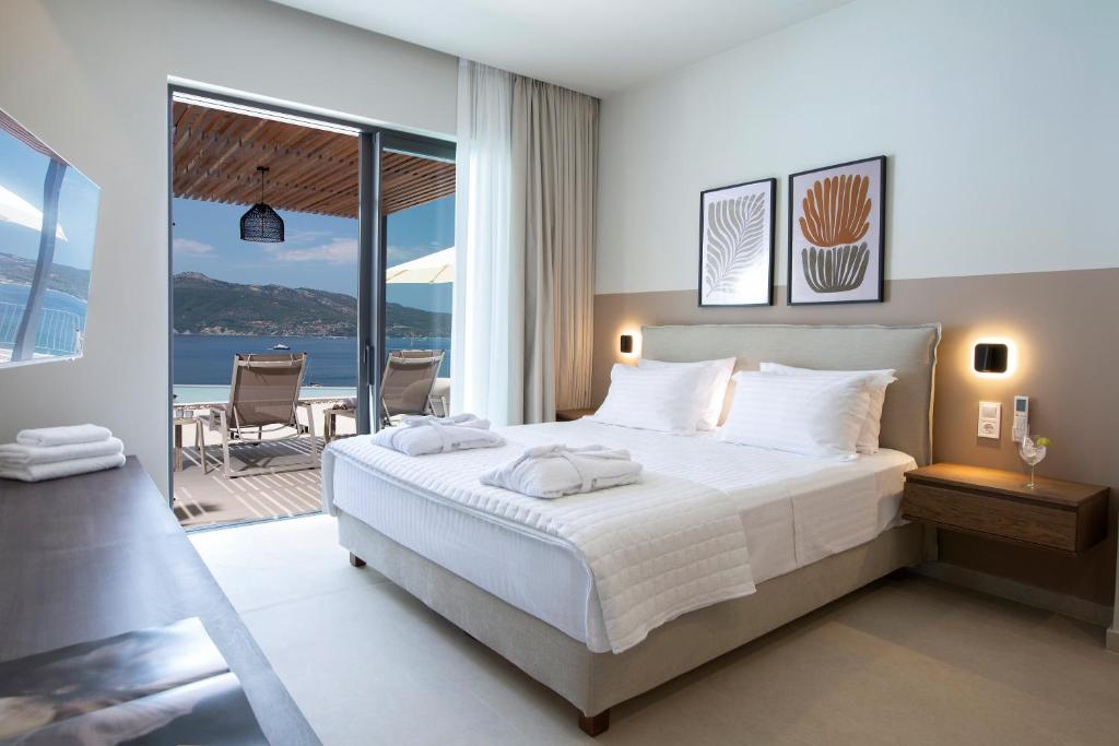 Master bedroom with sliding doors to a pergola terrace and sea view