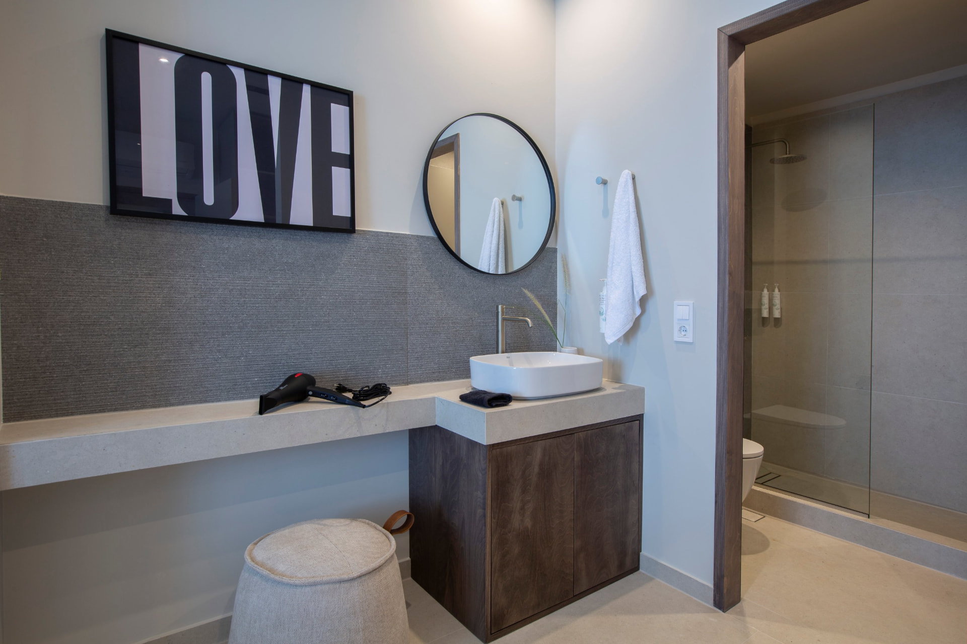 Modern bathroom with walk-in shower and vanity area